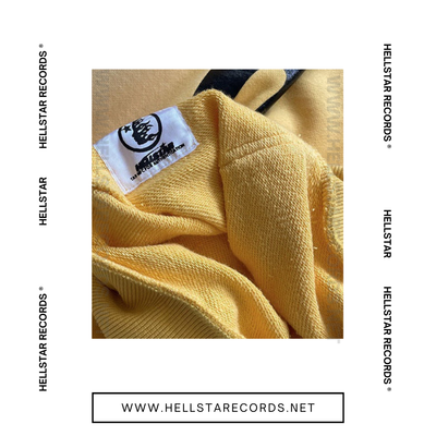 Close view of Hellstar Studios Zip-Up Hoodie available in grey, blue, and yellow with flame designs and Hellstar Records logo.