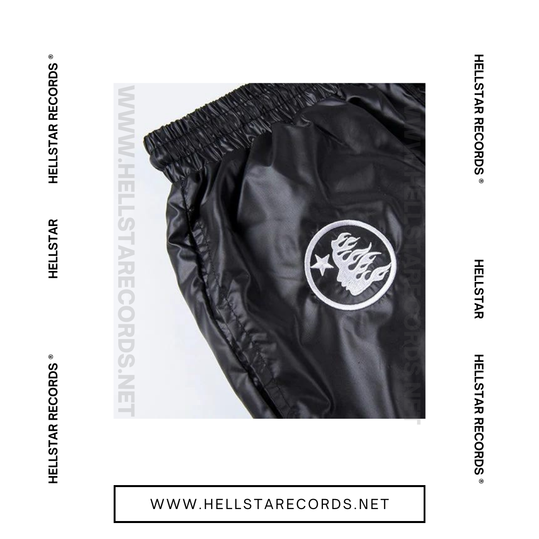 Close view of Hellstar Waxed Nylon Shorts in black with silver graphic logo