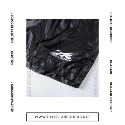 Close view of Hellstar Waxed Nylon Shorts in black with silver graphic logo