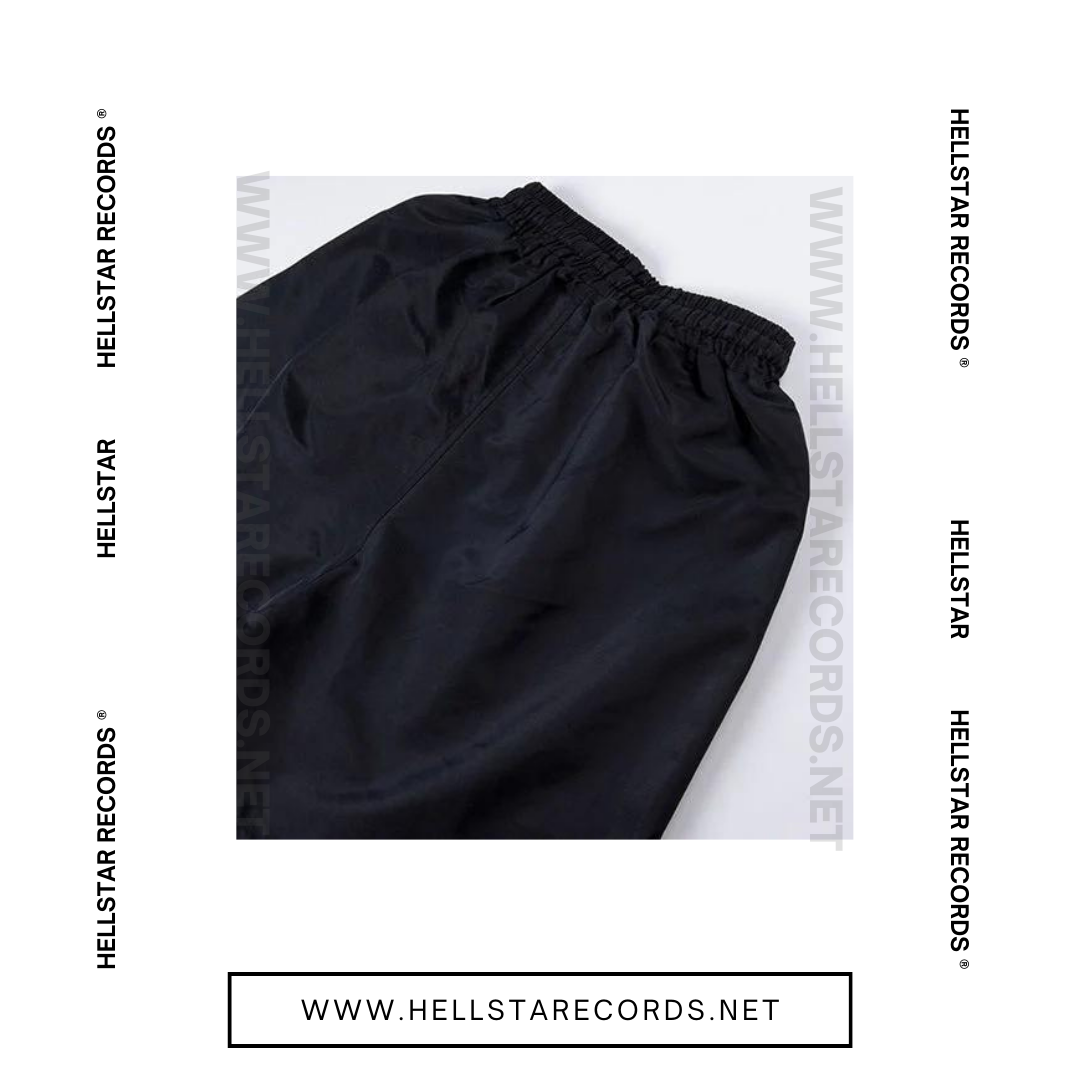 Close view of Hellstar Waxed Nylon Shorts with white drawstring on black fabric