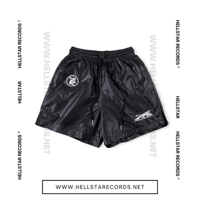 Front view of Hellstar Waxed Nylon Shorts in black with silver graphic logo