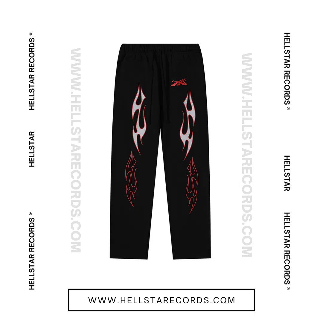 Front view of Hellstar Sports Future Flame Sweatpants featuring bold red and white flame graphics on black fabric.